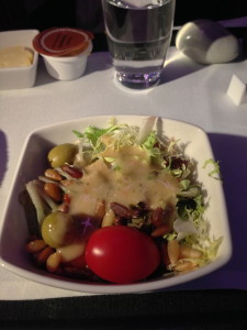 Mixed salad with pine nuts and green olives with French vinaigrette