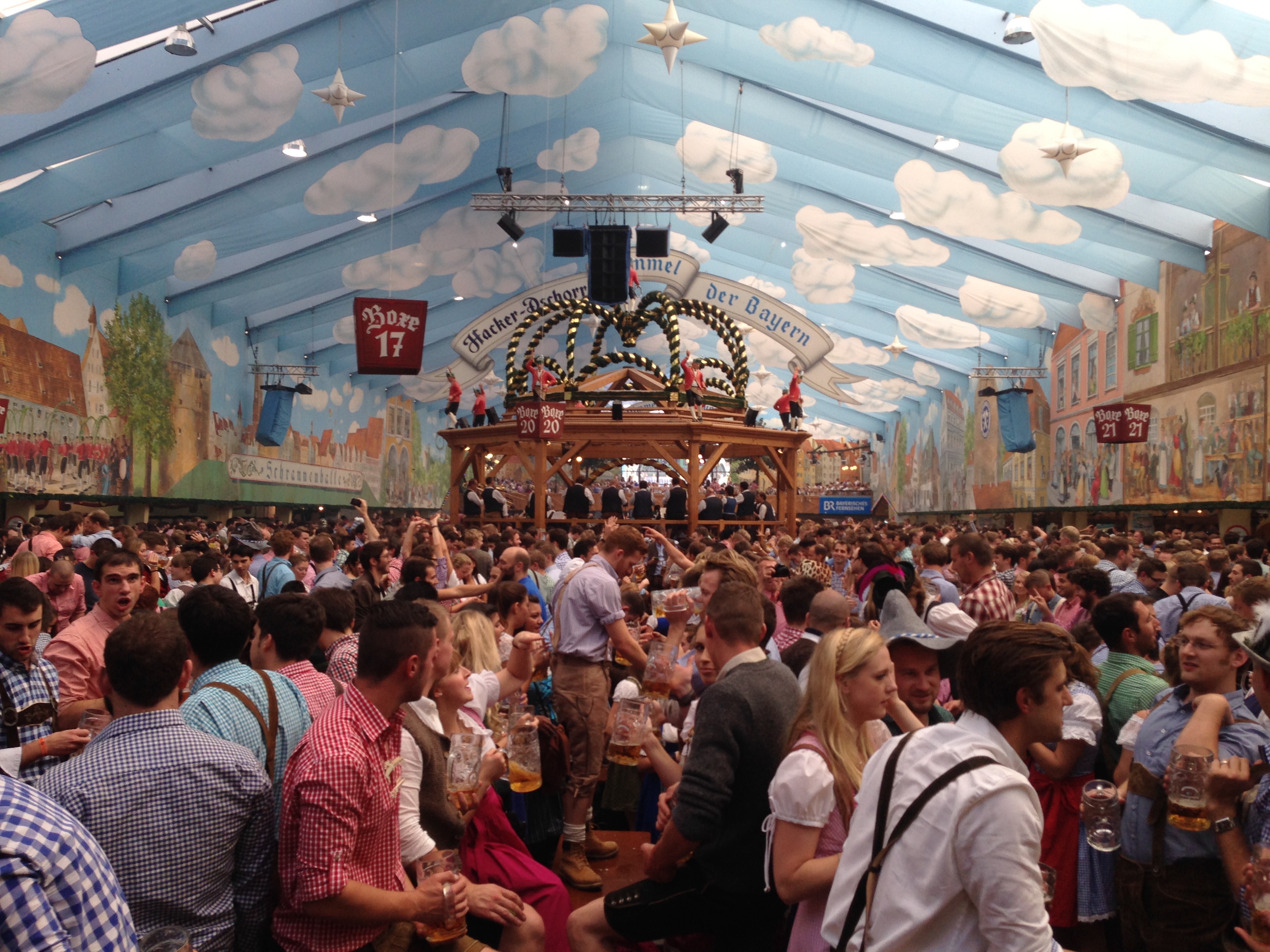 a large crowd of people in a tent